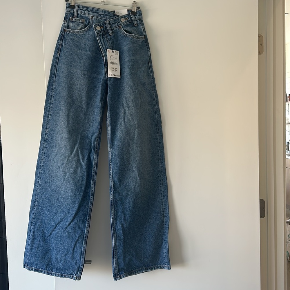 Brand new with tags High Rise Wide Leg Asymmetrical Jeans. Never Worn!